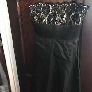 Strapless, lace topped evening dress.